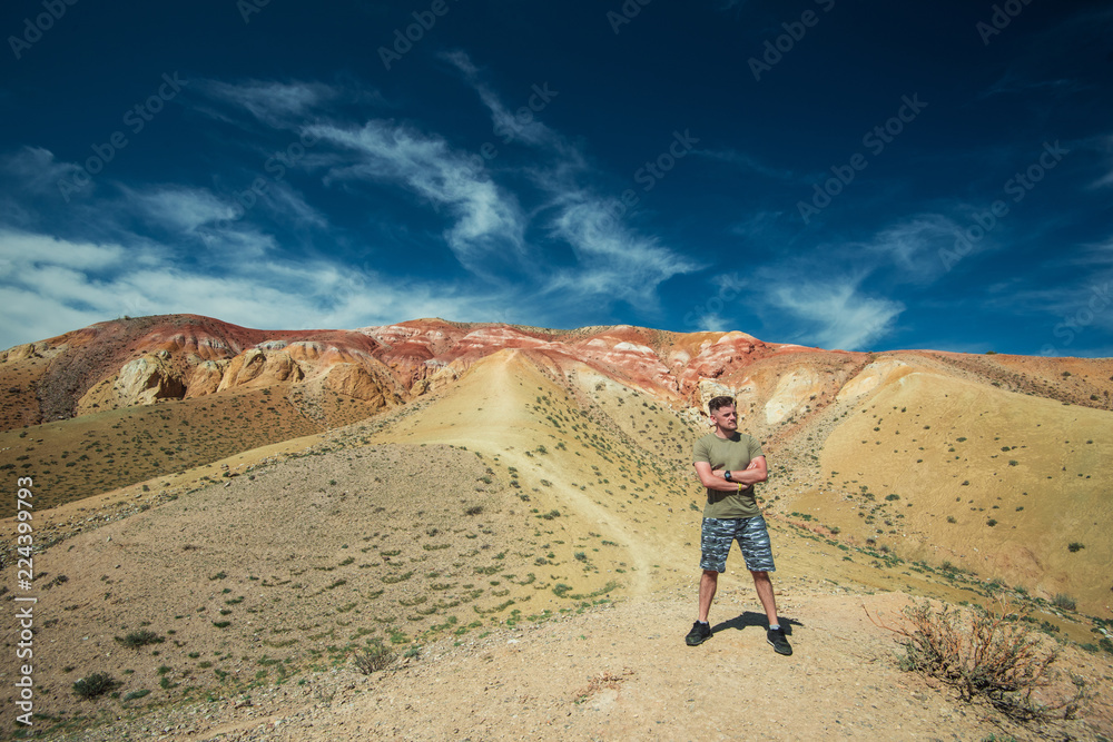 Man in Valley of Mars landscapes in the Altai Mountains, Kyzyl Chin, Siberia, Russia