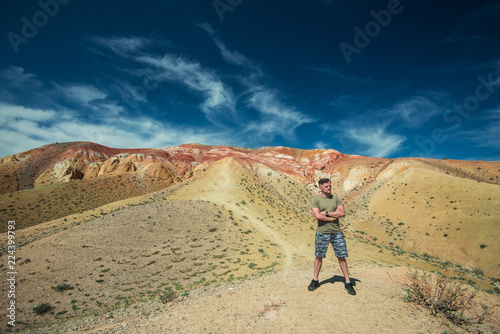 Man in Valley of Mars landscapes in the Altai Mountains, Kyzyl Chin, Siberia, Russia