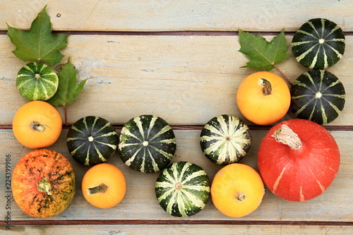 Cluster of beautiful decorative pumpkins on a vintage table
