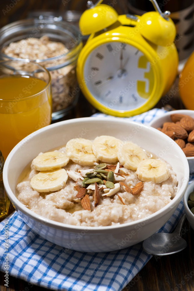 oatmeal with banana, honey and nuts, vertical