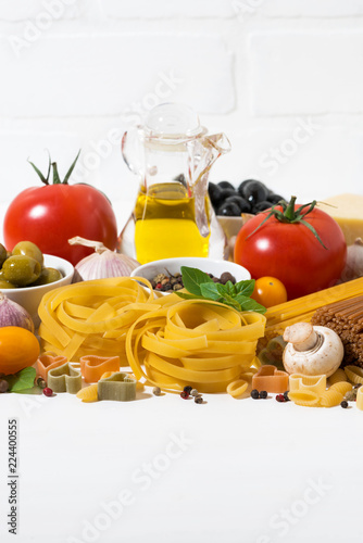 Fototapeta Naklejka Na Ścianę i Meble -  Ingredients for cooking pasta, vertical closeup