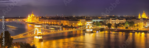 Budapest city night scene. View at Chain bridge, river Danube and famous building of Parliament