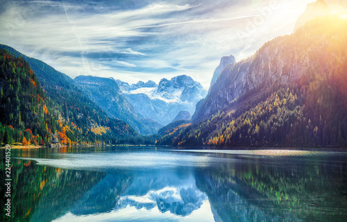 autumn scenery with Dachstein mountain summit reflecting in crystal clear Gosausee mountain lake © pilat666