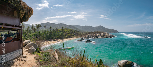 Beautiful Caribbean beach with palm trees in Tayrona National Park close to Santa Marta in Northern Colombia photo