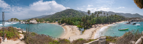 Beautiful Caribbean beach with palm trees in Tayrona National Park close to Santa Marta in Northern Colombia photo