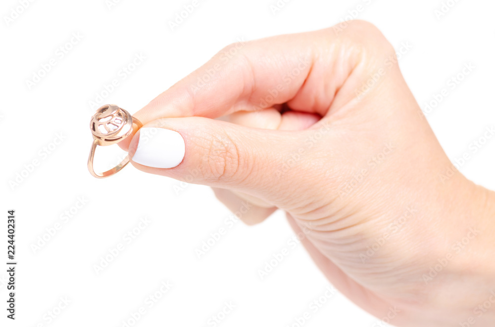 Gold ring in hand on white background isolation