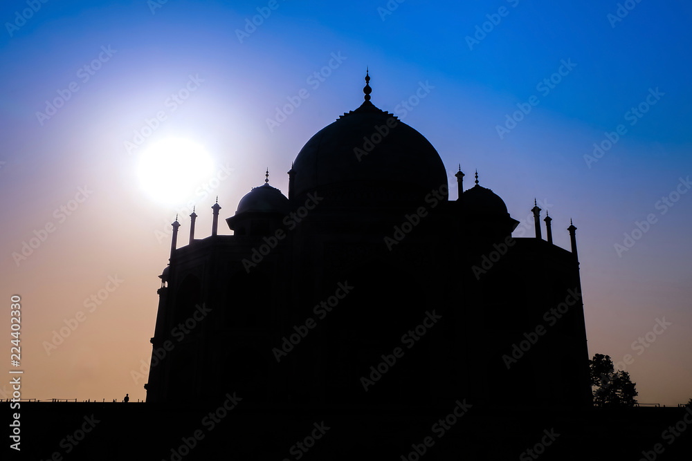 Sunrise silhouette of Taj Mahal in Agra, India.