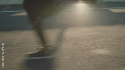 close up athlete legs running on road fit runner jogging sprinting endurance exercise in urban city morning at sunrise