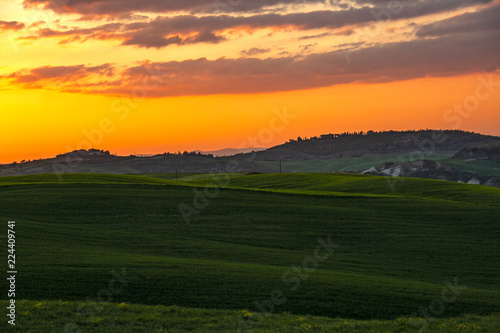 Landscape of tuscan countryside at sunset