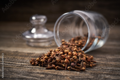 Dried cloves  on a gray wooden background