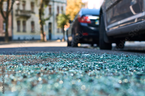 Sharp shards of car glass on the asphalt © berezko