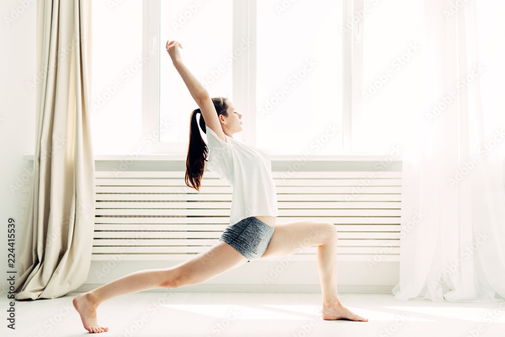 Young beautiful girl doing warm-up contemporary at home Young beautiful girl doing warm-up contemporary at home