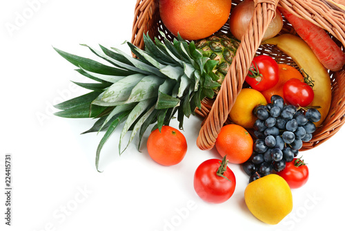 Vegetables and fruits in a basket isolated on white background. Free space for text.