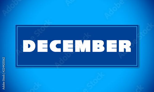 December - clear white text written on blue card on blue background