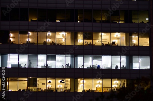 Wallpaper Mural Office building at night. Late night at work. Glass curtain wall office building Torontodigital.ca