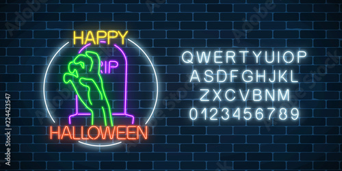 Glowing neon sign of halloween banner design with bony hand from grave and alphabet. Halloween night scary sign