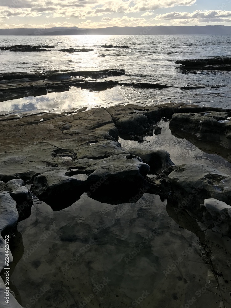 Obraz premium Sunset Reflecting on Coast