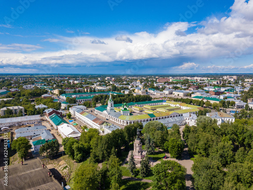 Aerial view to Kostroma city center with old trace buildings, churches and Central park with Lenin monument at summer.