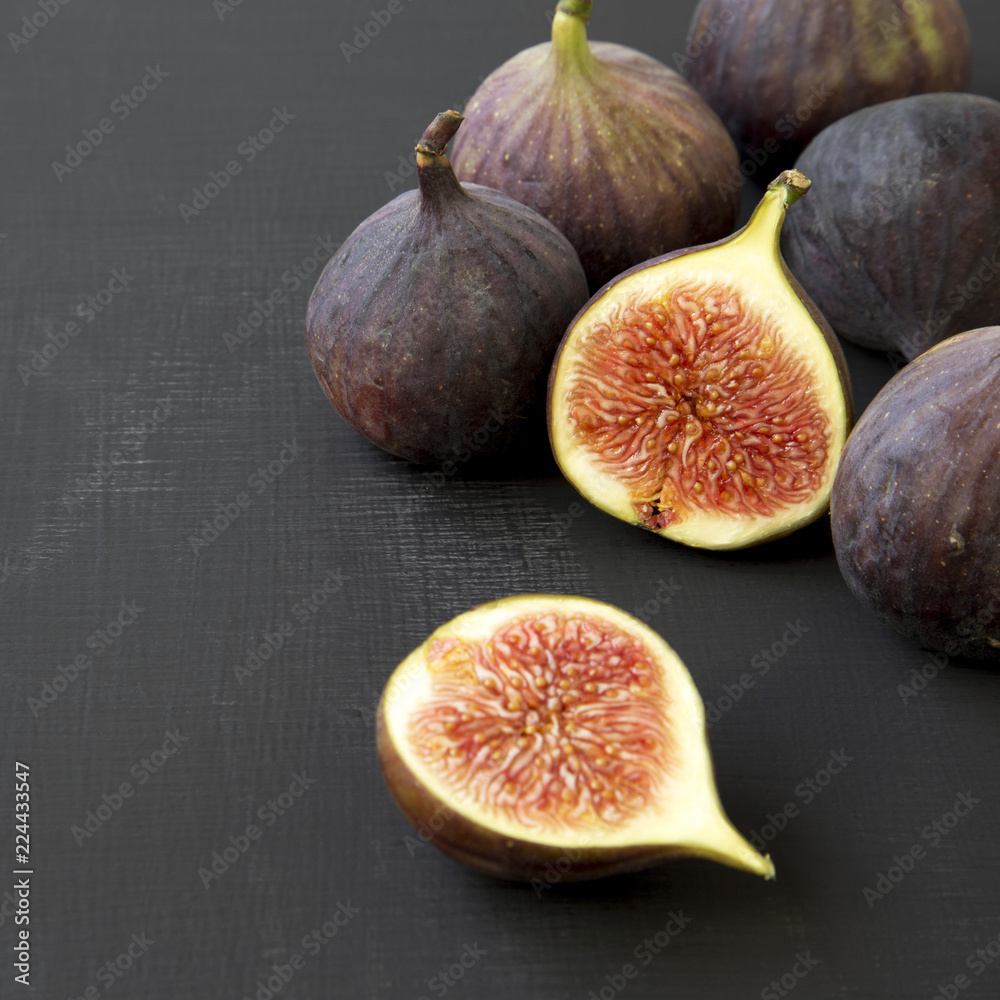 Fresh figs on black background, side view. Close-up. Fresh figs on black background, side view. Close-up.