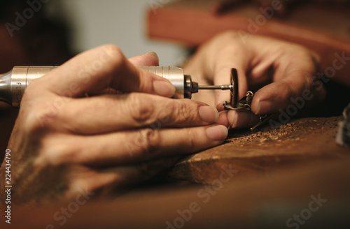 Jeweler makes a piece of jewelry