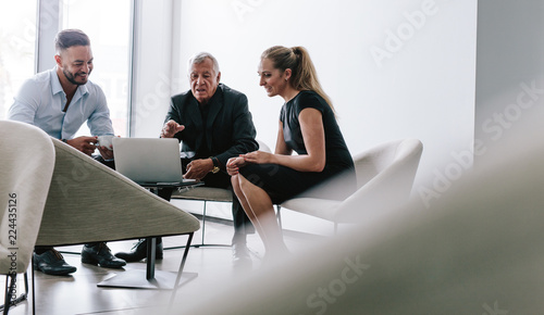 Business team discussing over new project photo