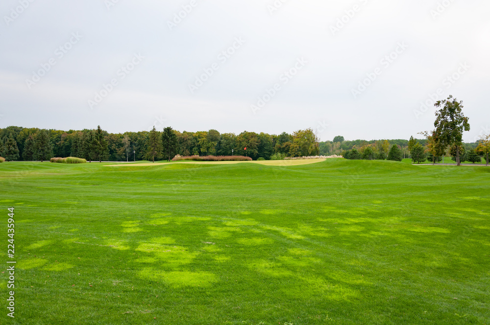 Golf course with green grass