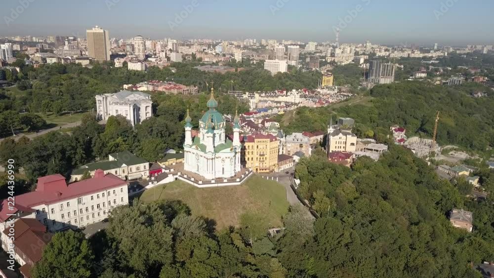 Famous touristic places in Kyiv - Aerial view to St Andrew's Church and Andriyivskyy Descent in capital of Ukraine Famous touristic places in Kyiv - Aerial view to St Andrew's Church and Andriyivskyy Descent in capital of Ukraine