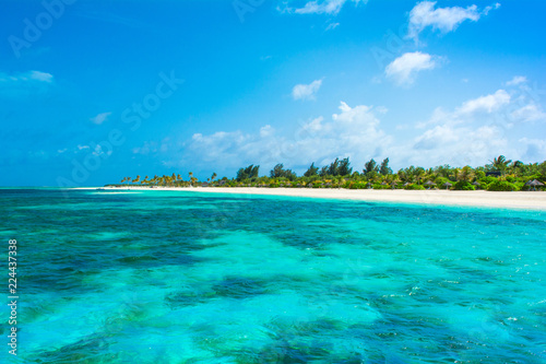 Fototapeta Naklejka Na Ścianę i Meble -  Beautiful sandy beach with sunbeds and umbrellas in Indian ocean, Maldives island