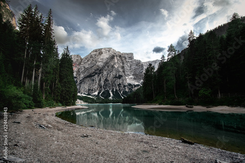 Pragser Wildsee in the summer from a long distance with clouds and dark colors (ID: 224438943)