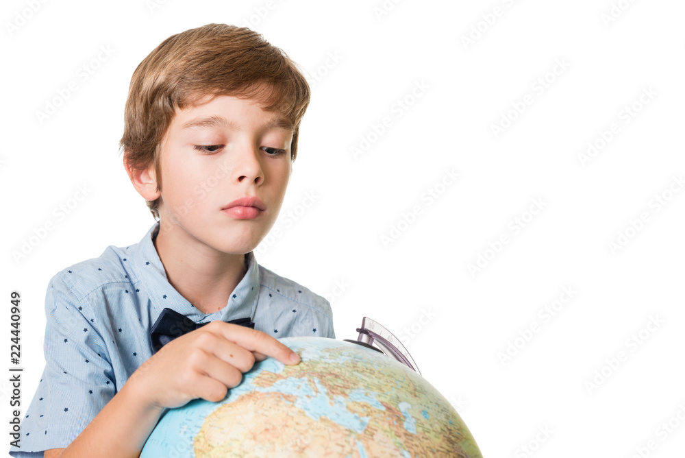 young adorable boy looking at globe, isolated on white background with space for text young adorable boy looking at globe, isolated on white background with space for text