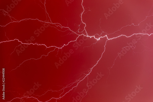 Lightning bolt in a red sky.
