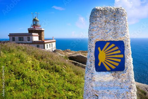 Saint James Way sign and lighthouse of Finisterre photo