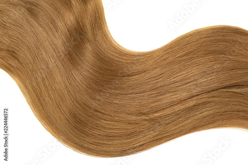 Curl of natural brown hair on white background. Wavy ponytail