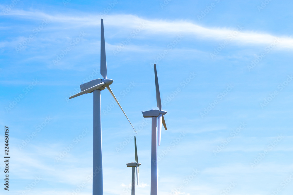 modern wind power generators against the blue sky, toned modern wind power generators against the blue sky, toned