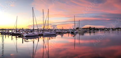 Sunrise over a quiet harbor in old Naples, Florida