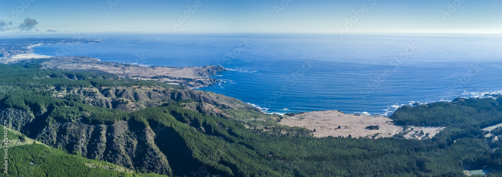 Fototapeta premium An aerial drone view over Tunquen Beach in Valparaiso region and close to Algarrobo, an awesome beach with a lot of wildlife because of it wetlands and turquoise waters, an idyllic travel destination