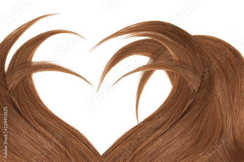 Brown (dark) hair in shape of heart, isolated on white background