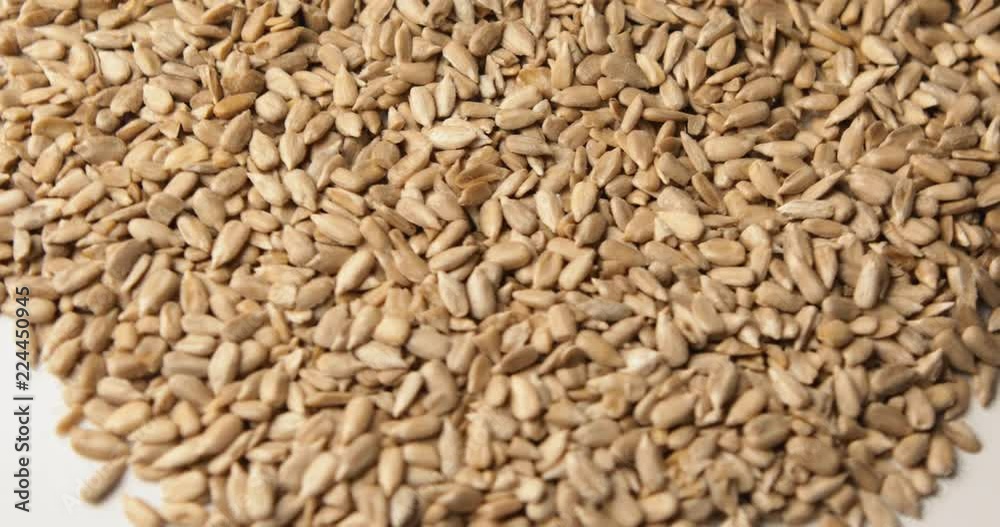 Peeled sunflower seeds close up rotation. Food background. Gastronomy concept, organic food. Macro sunflower seeds
Peeled sunflower seeds close up rotation. Food background. Gastronomy concept, organic food. Macro sunflower seeds