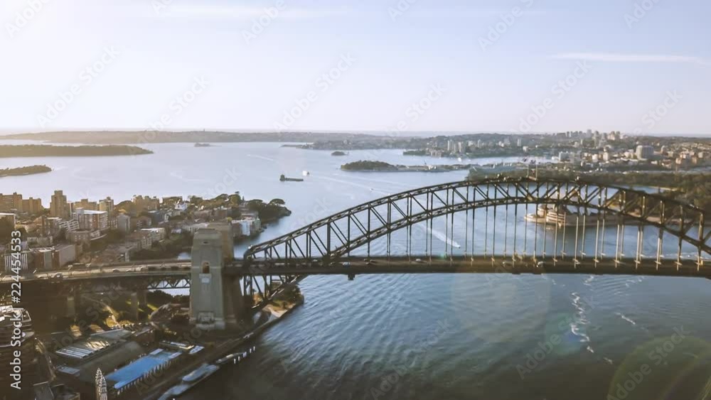 4k aerial hyperlapse drone lapse of Sydney city skyline during sunrise. Aerial view with cinematic establishing shot and flare effect. 4k aerial hyperlapse drone lapse of Sydney city skyline during sunrise. Aerial view with cinematic establishing shot and flare effect.