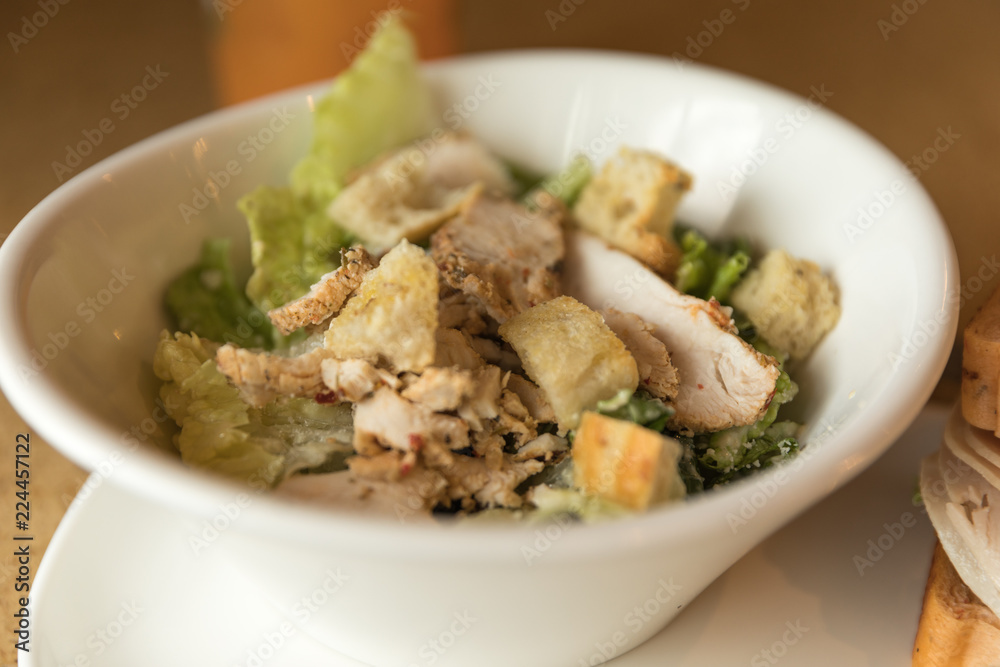 Chicken Caesar salad taken in natural light Chicken Caesar salad taken in natural light