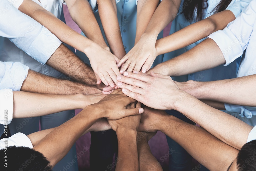 Handshake of many young business people, teamwork Handshake of many young business people, teamwork