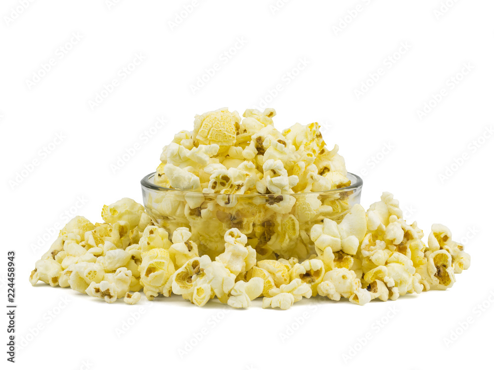 A pile of popcorn in a glass bowl isolated on a white background.