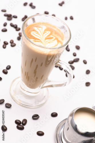 Hot Cappuccino  coffee  in clear glass on a white background in the studio.	