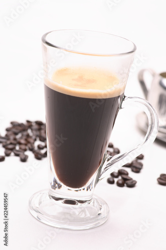 hot coffee  in clear glass on a white background in the studio.	