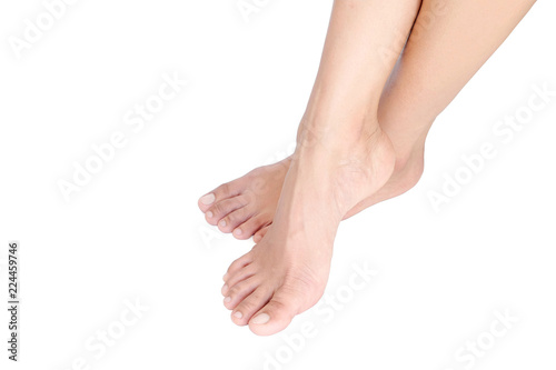 Beautiful female legs and feet on a white background. © Photo Sesaon
