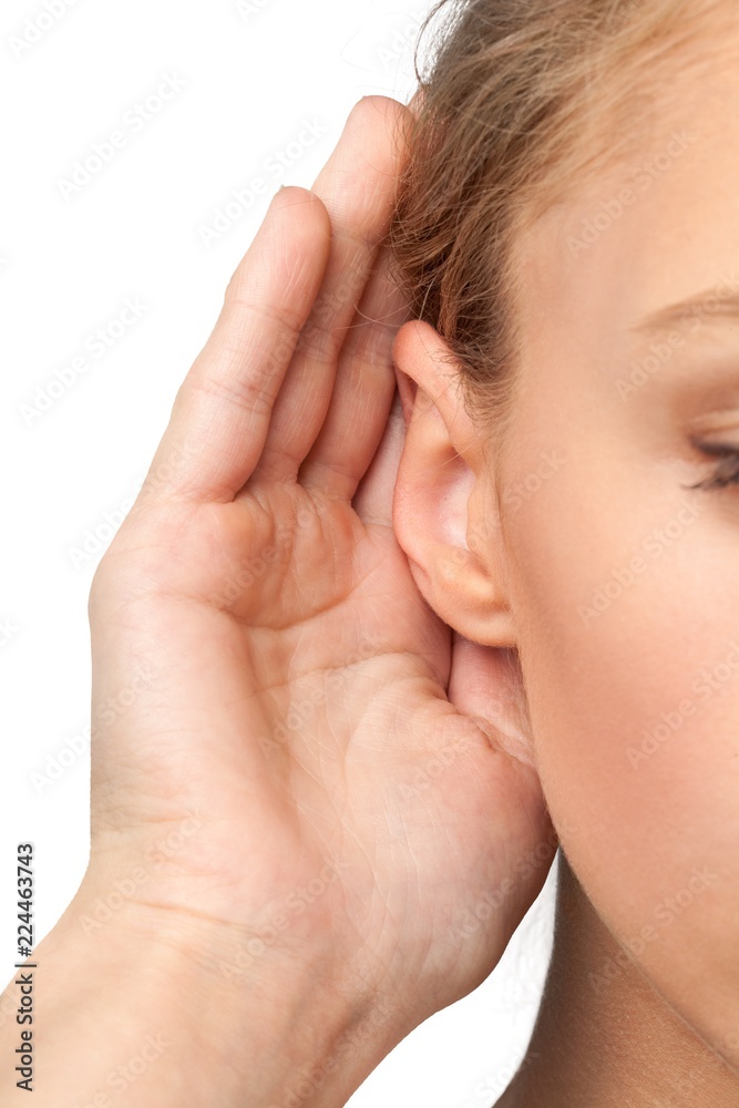 Closeup on a Woman Holding her Hand Near her Ear Closeup on a Woman Holding her Hand Near her Ear