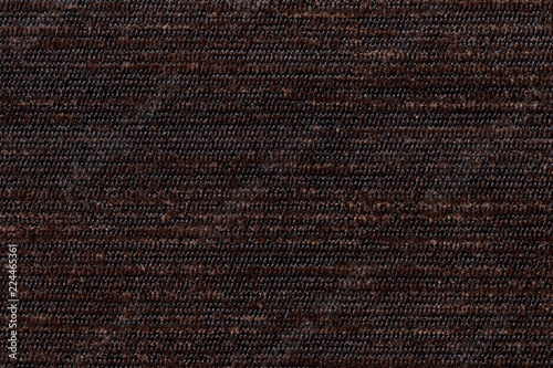 Dark brown background from soft textile material. Fabric with natural texture.