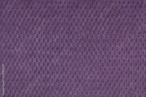 Dark violet background from soft fleecy fabric closeup. Texture of textile macro
