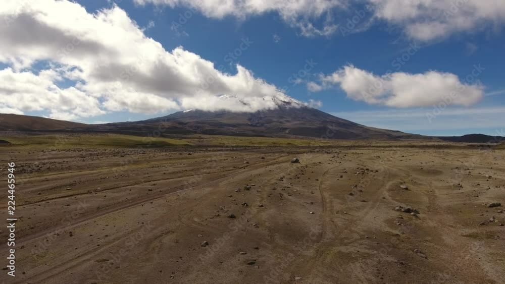 Rising up from a lichen covered plain strewn with boulders towards Cotopaxi Volcano in the Ecuadorian Andes Rising up from a lichen covered plain strewn with boulders towards Cotopaxi Volcano in the Ecuadorian Andes