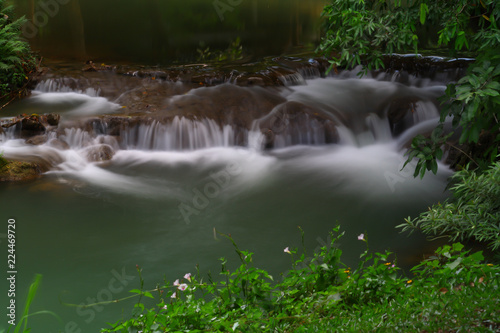Waterfalls in the lush and beautiful forests of Thailand. © Pongvit